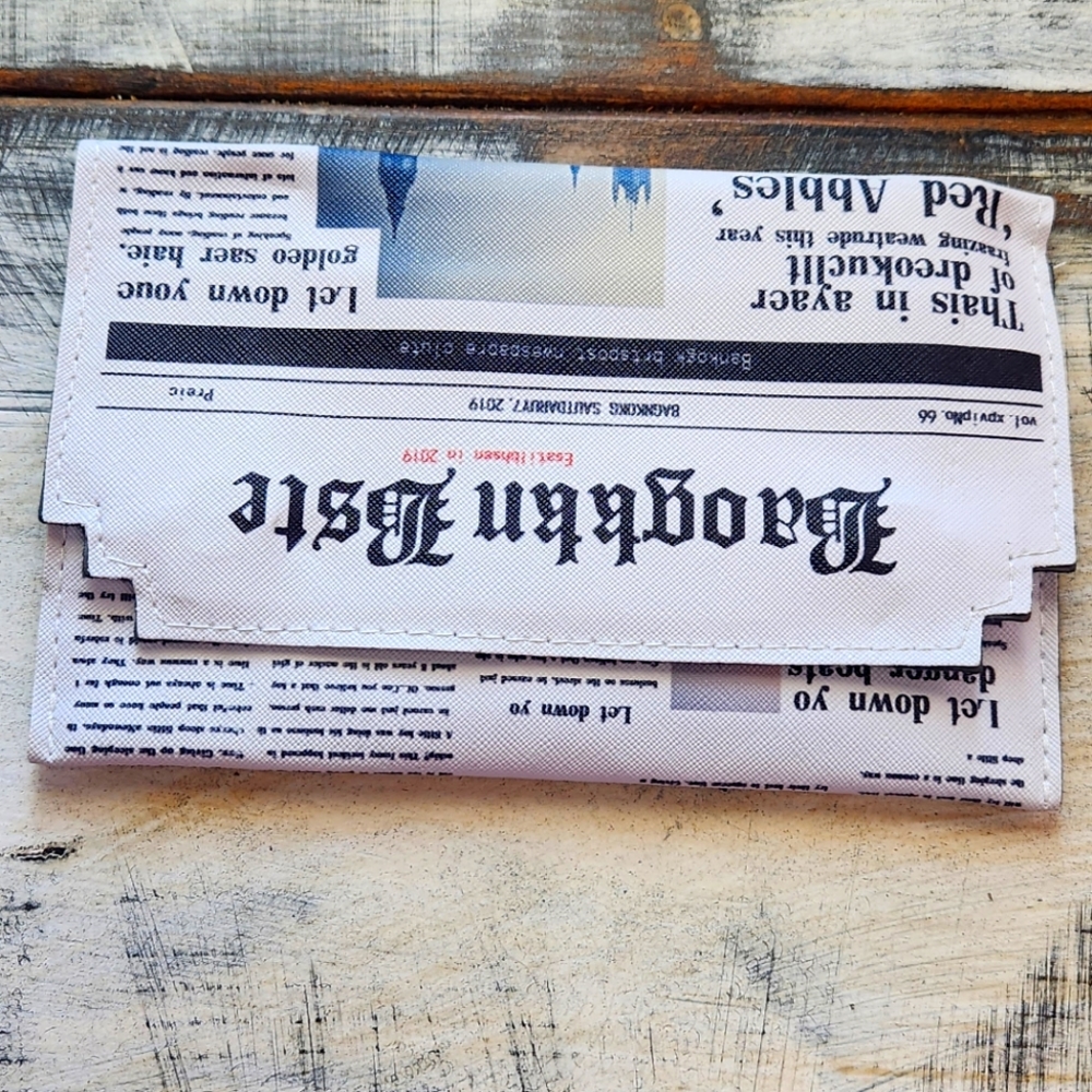 Newspaper print shoulder bag envelope shape